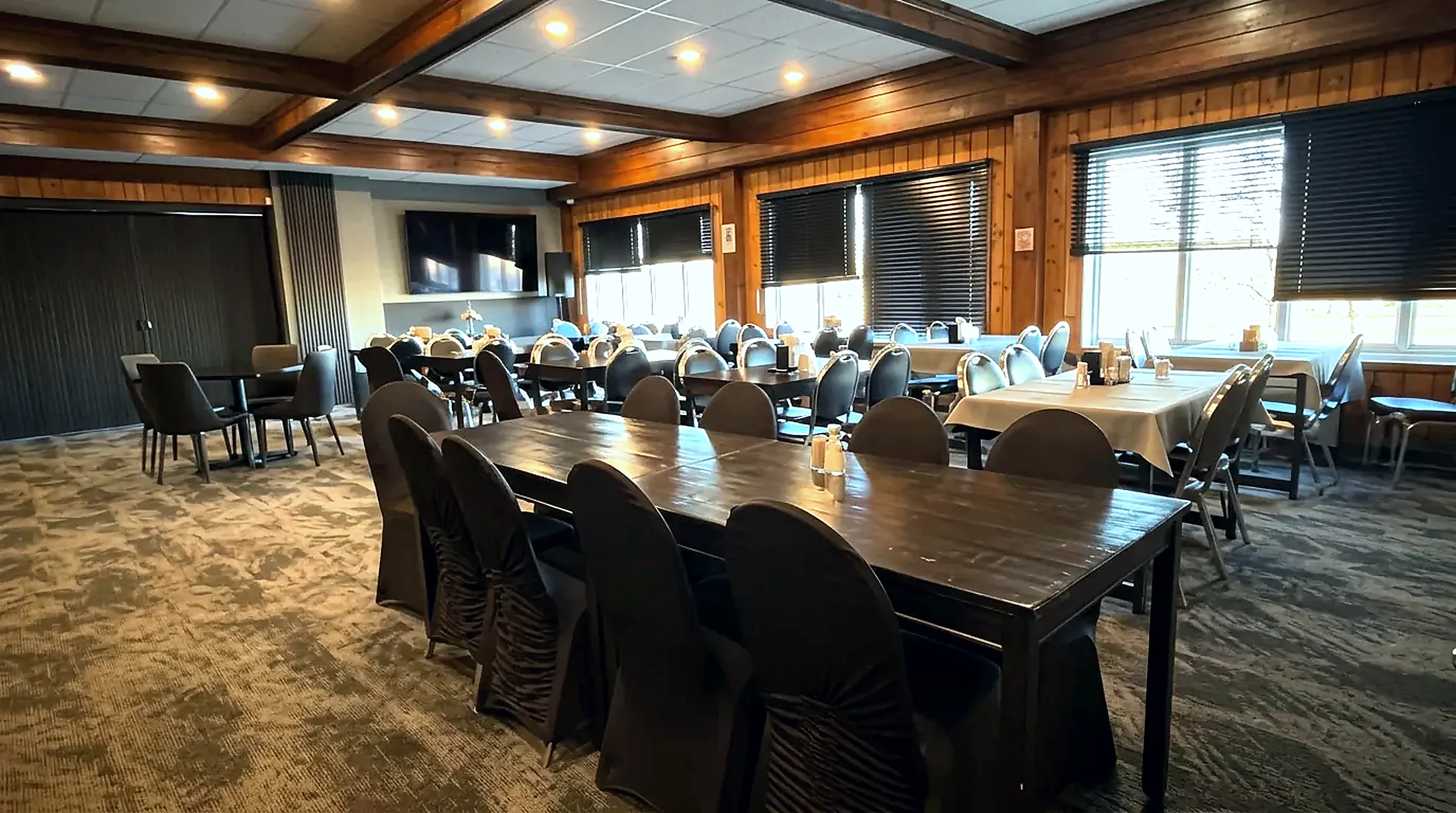 The large meeting room at the Wabush Hotel set with long tables and chairs for a group The large meeting room at the Wabush Hotel set with long tables and chairs for a group