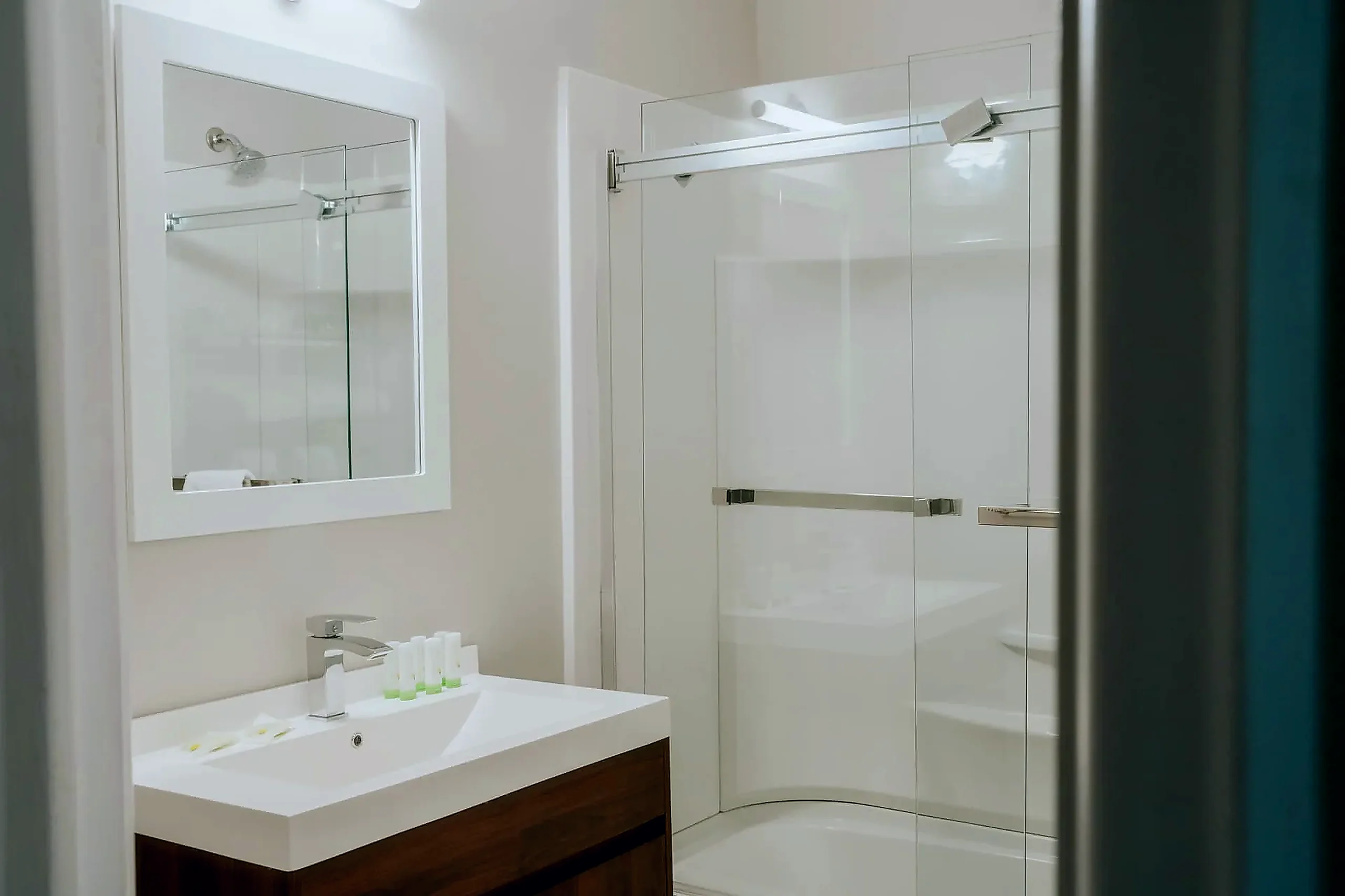 Private bathroom in every room Private guest bathroom at the Wabush Hotel with a glass shower and vanity