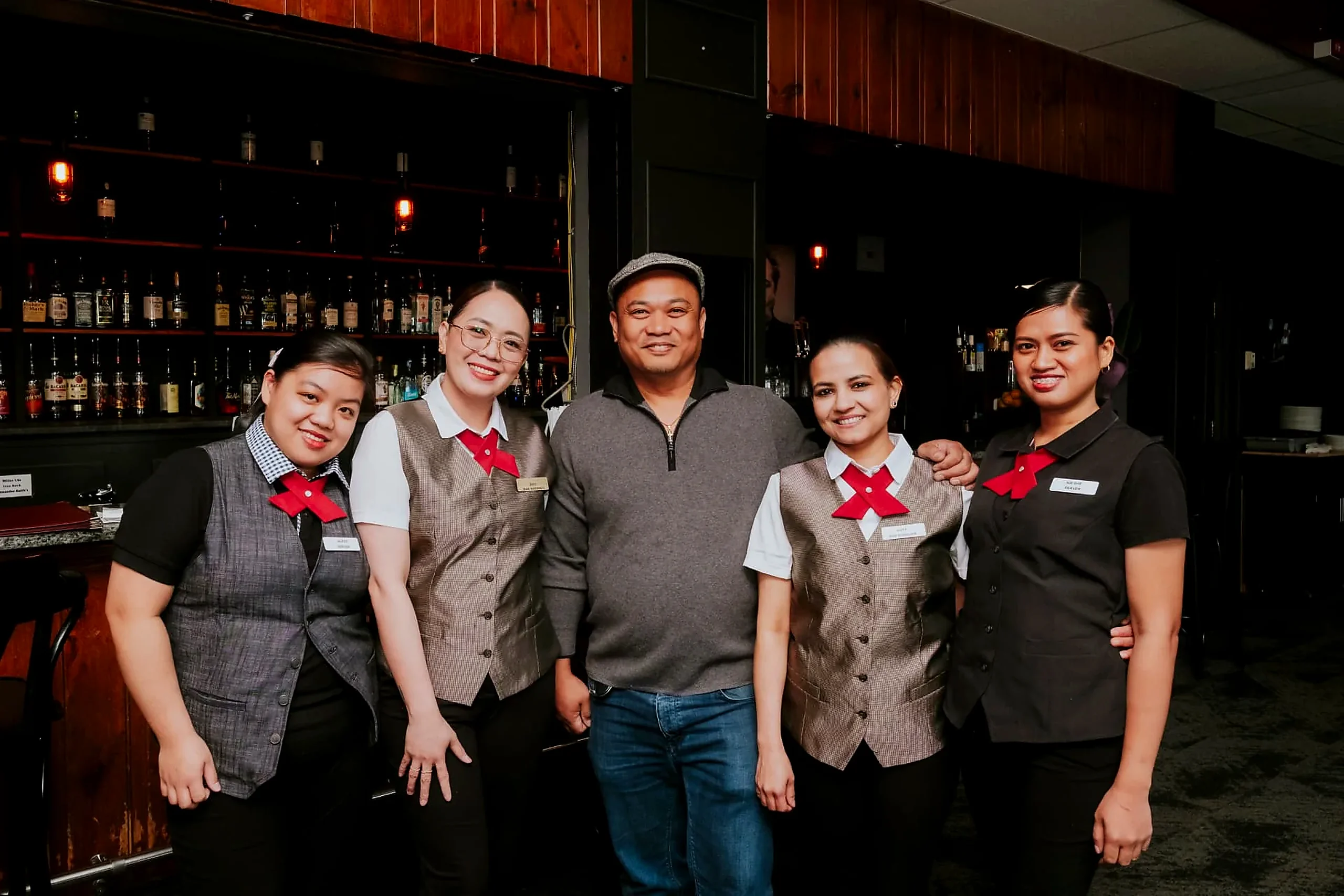 The Wabush Hotel restaurant and bar team standing behind the bar